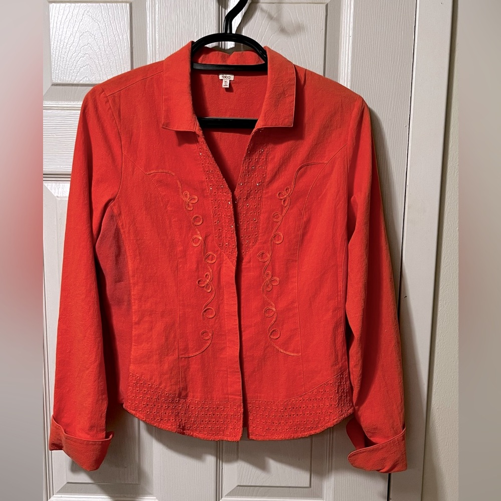 Bright orange button down blouse by Reba.